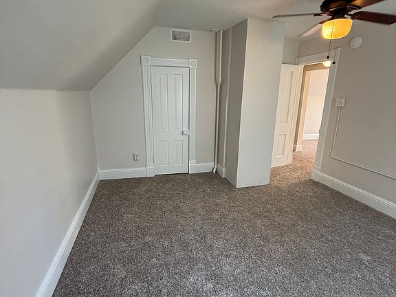 Spacious living room with two closets for storage.