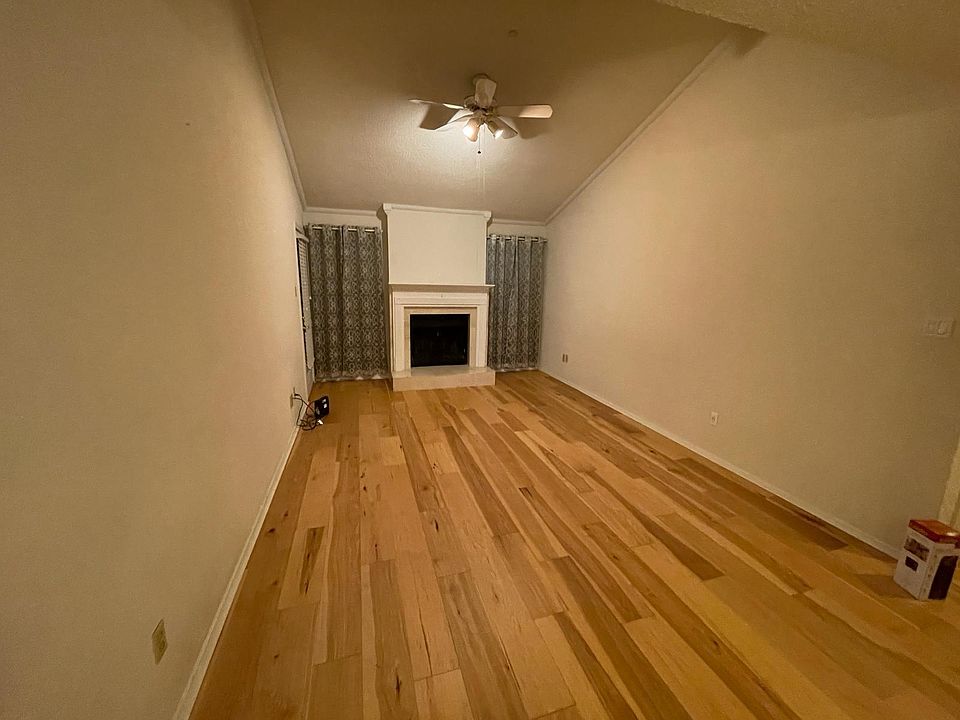 Living room with wood-burning fireplace