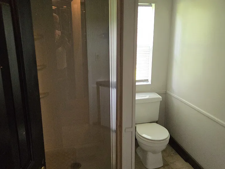 rear bath with shower next to master bedroom