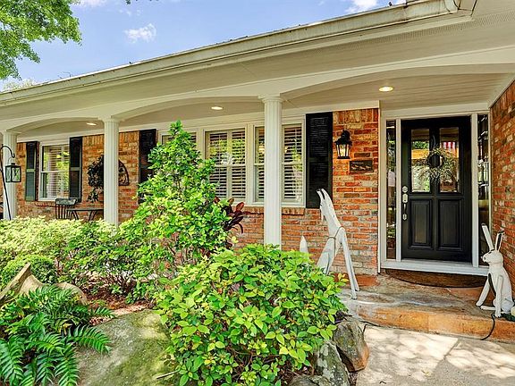 Note the flagstone covered front porch to sit out front and enjoy the neighborhood and beautiful yard.  The sellers recently ins
