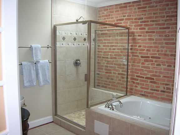 Gorgeous Master Bath w/skylight & exposed brick details!