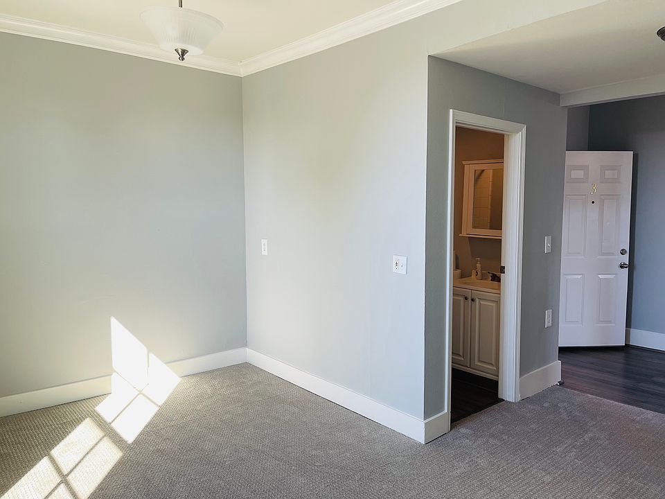 Entrance on the right, then bathroom, then the living room
