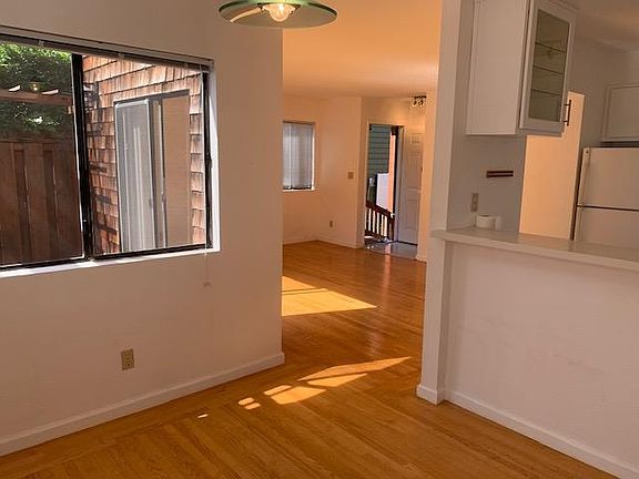 view from dining room to living room and patio