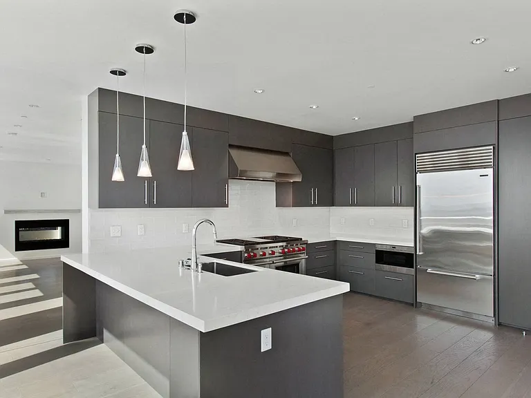Designer kitchen includes Wolf, Bosch & Sub Zero appliances and custom cabinetry.