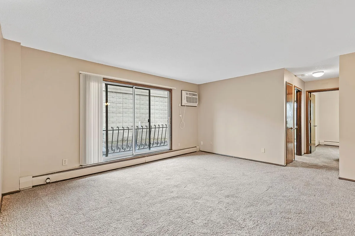 Living room with balcony - Wexford Commons