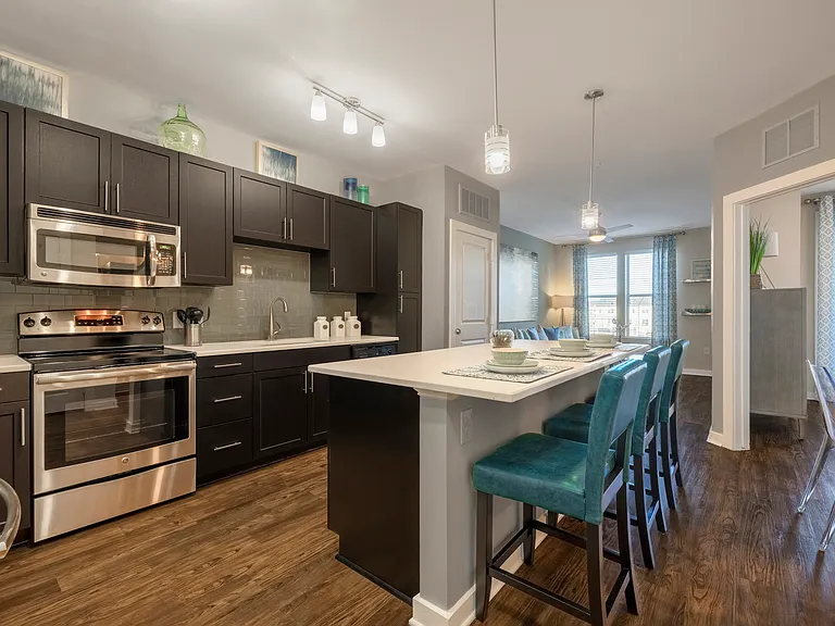 Kitchen with island and bar-style seating