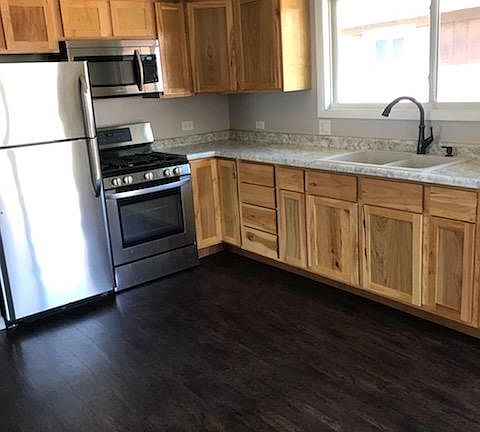 Recently remodeled kitchen with stainless appliances and hickory cabinets