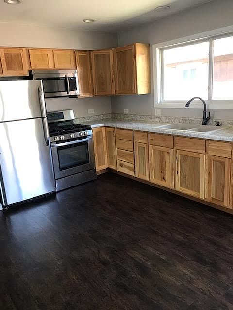 Recently remodeled kitchen with stainless appliances and hickory cabinets
