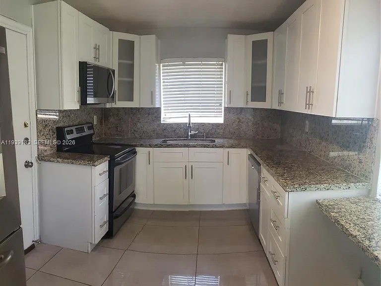 1450 NE 191st St #201 — Photo 1