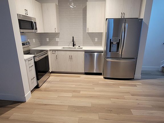 Nice open concept of kitchen and great room, nice natural light as well as can lights overhead.