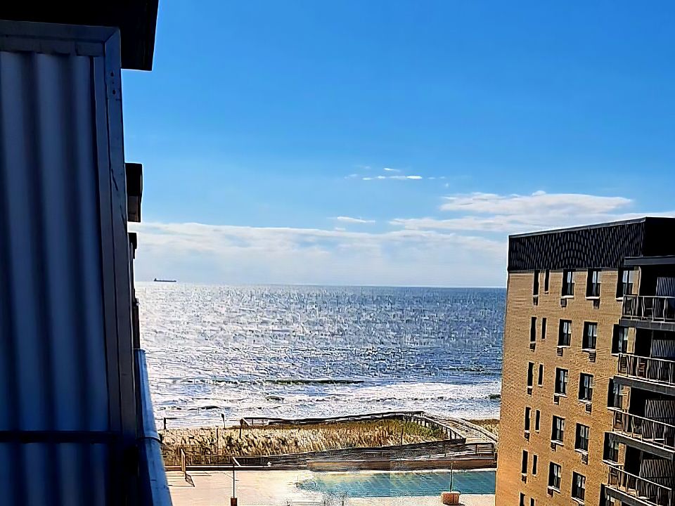 View from private balcony. Has heated pool and direct beach access. Party room.