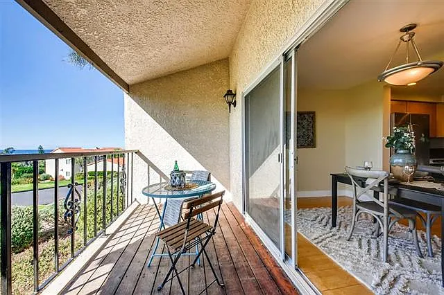 The dining room and living room open up to the beautiful patio via sliding glass doors. (Please note this property does not come furnished)