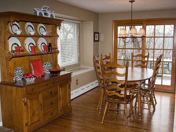 Dining Room with Window Seat and French Doors to Deck.