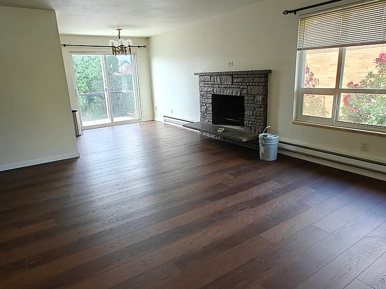 Spacious and bright living room, new floors throughout.