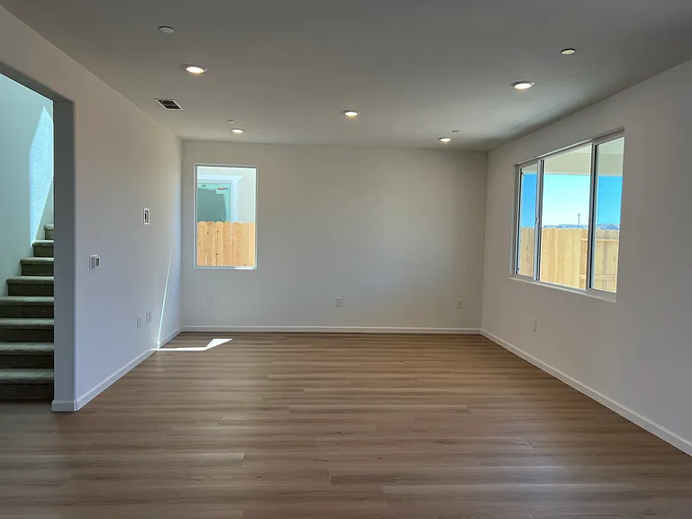 Great Room: An open, sun-filled great room designed for real living _ big windows, neutral tones, and room to relax or entertain