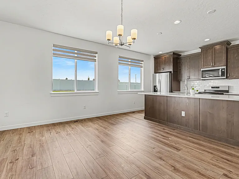 Kitchen with Gas Stove, Oven, Microwave and Refrigerator