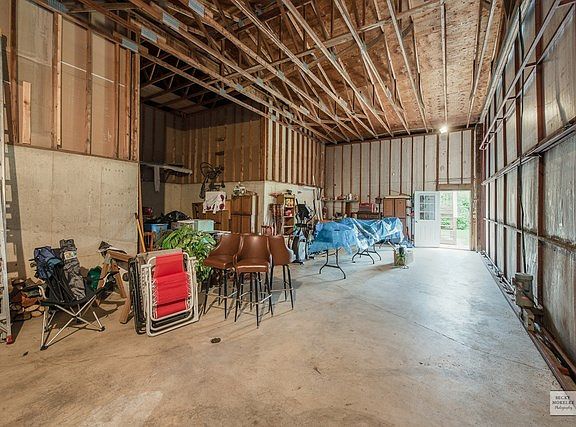 42' wide T-shaped airplane hangar for storing your toys, housing your workshop and throwing parties!