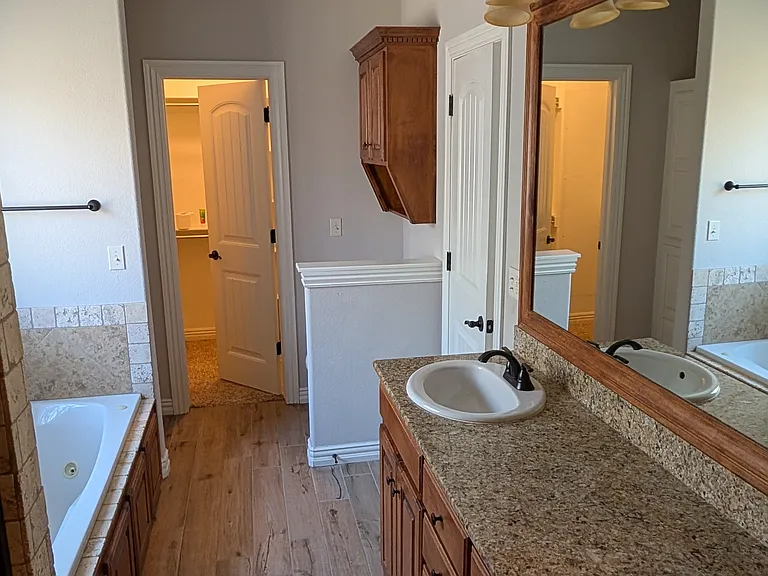 Master Bathroom with double vanity and 2 walk-in closets. Walking Closet #1.