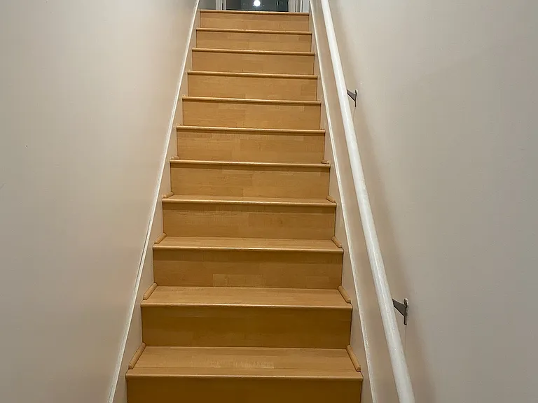 Two staircases in unit. This one leads from Garage to Main Floor