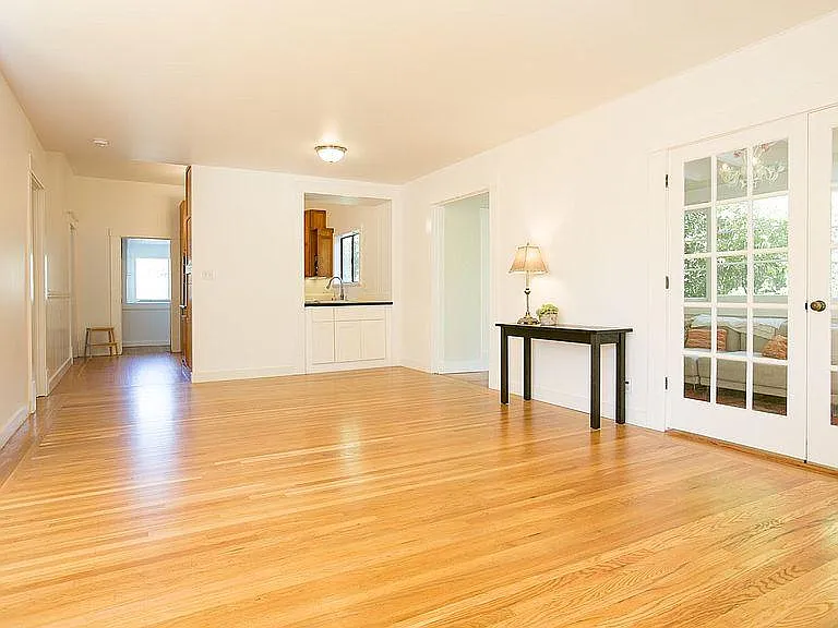 Looking toward kitchen and long office entertainment room with ensuite bath.