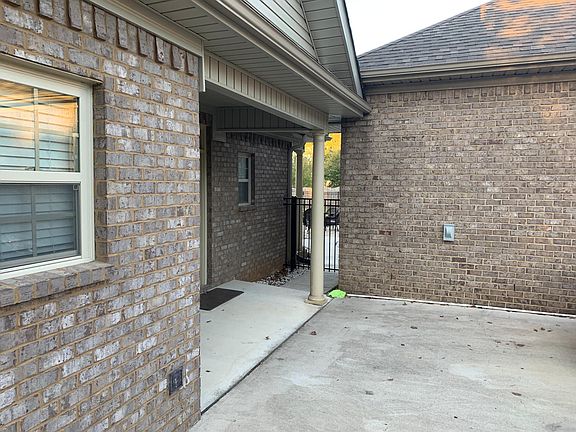 Front of guest house, view toward back of main house and pool.