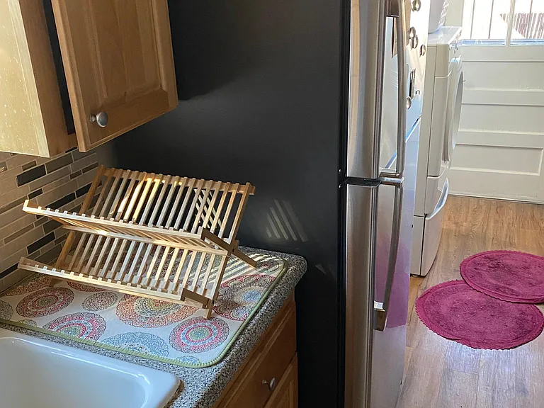 Photo of the kitchen with the new stainless steel fridge