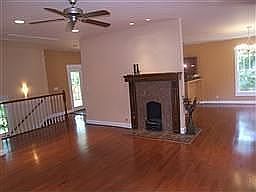 Living area perfect for gathering around the decorative gas log buring FP