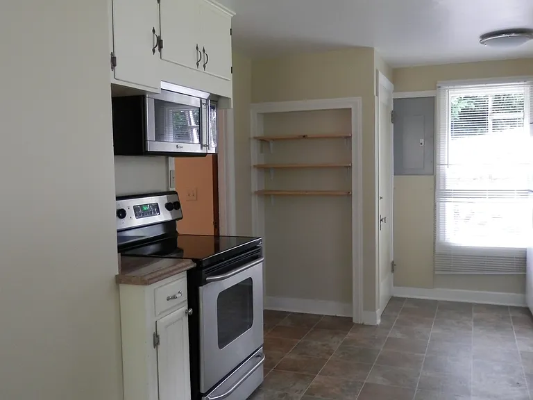 To the left of the window is the entrance to the basement