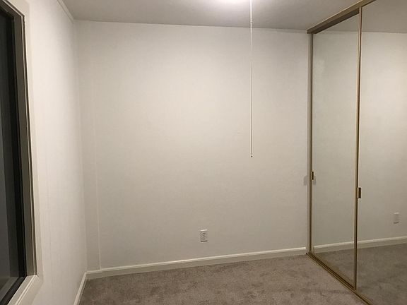 bedroom and mirrored closet 