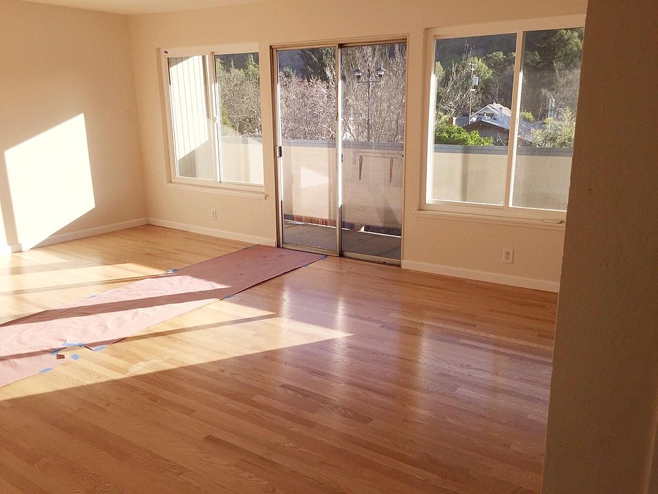 Oversized living room with balcony and eating area