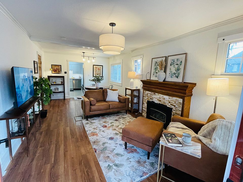 Sun drenched living Room with working gas fireplace.