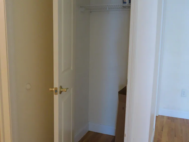 Entrance / hallway coat closet.