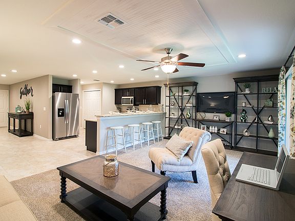 Open living area and gourmet kitchen with granite