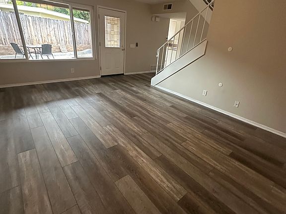 This rental features a welcoming living room with a large window for plenty of natural light, and offers total privacy with a lockable entry gate for added security. Perfect for anyone looking for a safe and comfortable home!