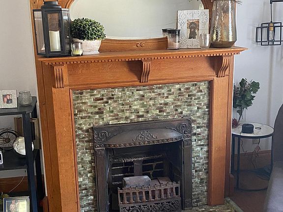 Decorative (candles only) fireplace in living room.