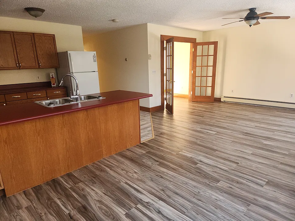 Open floor plan. French doors access bedroom with closet