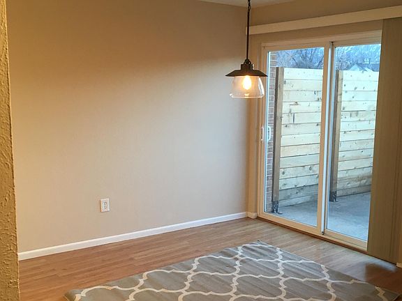 Dining area opens onto private patio with view of the mountains