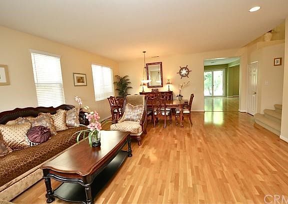 The living room is open to the formal dining room.