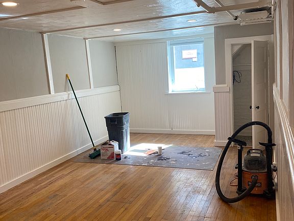 This is the living room. Egress windows were added in 2021, they let in SO MUCH LIGHT!