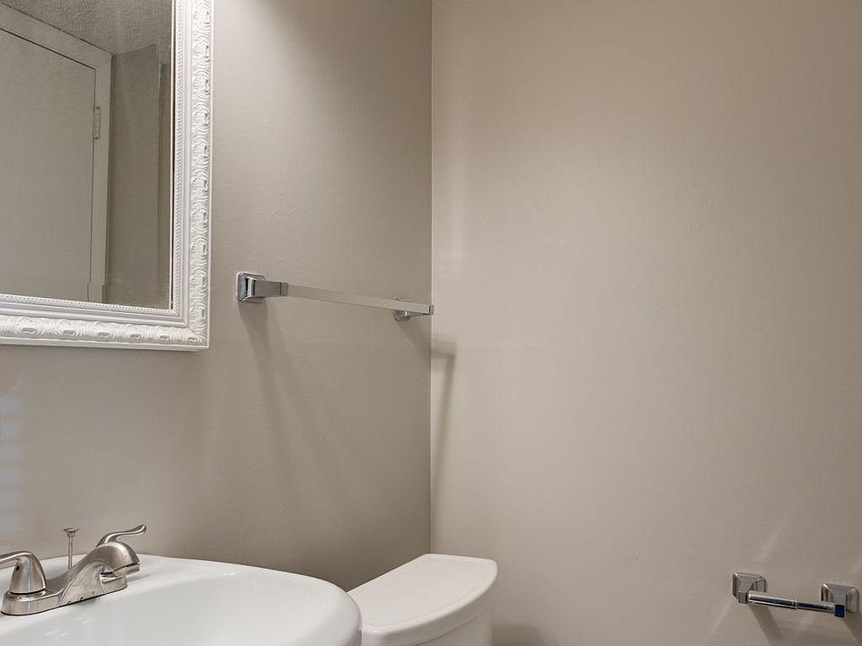 Half Bath off Kitchen with storage closet.