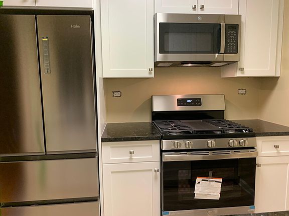 Brand New Kitchen with granite countertops and stainless steel appliances
