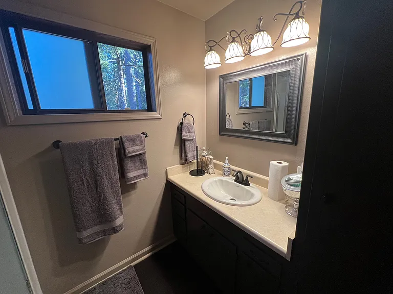 2nd Floor bathrroom, w/storage, shower and toilet
