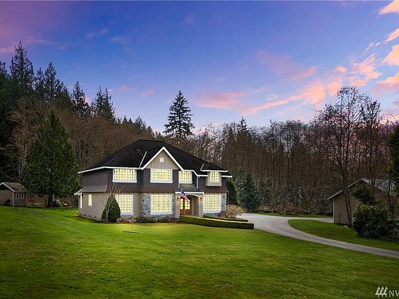 Twilight View Of The Main Home. Gorgeous Windows And New Solid Wood Entry Door. 2.5+ Acres Of Critical Area Property Behind The Home Allows For An Abundance Of Protected Privacy.