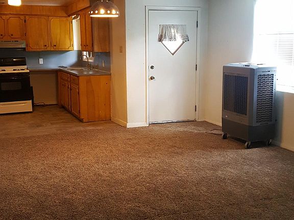 Entrance to section 1, new AC, new carpet, new paint, new vinyl tile in kitchen, new fridge