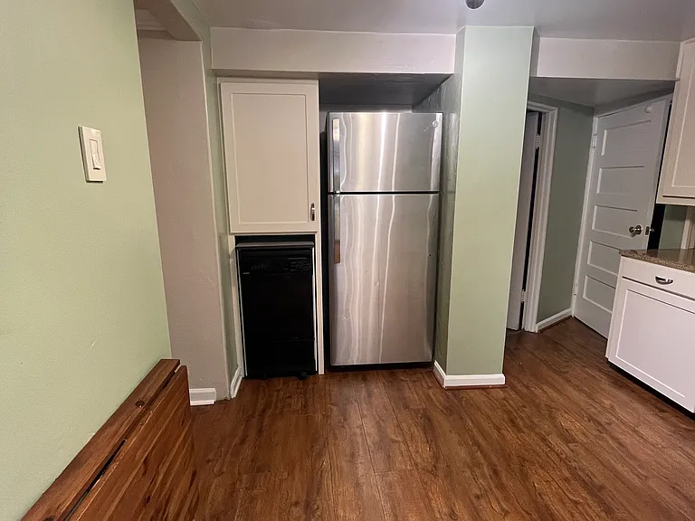 Full-size refrigerator and dishwasher on wheels that rolls to attach to the sink to run as needed