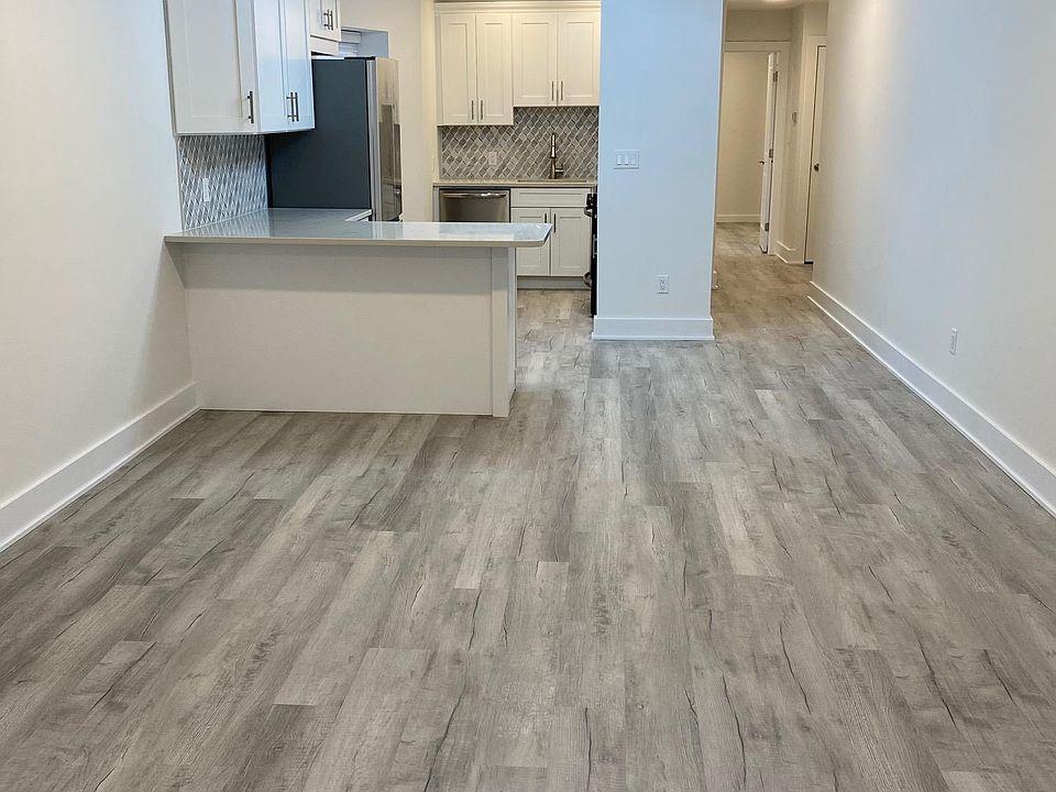 View of Kitchen, Living Room, and Entry