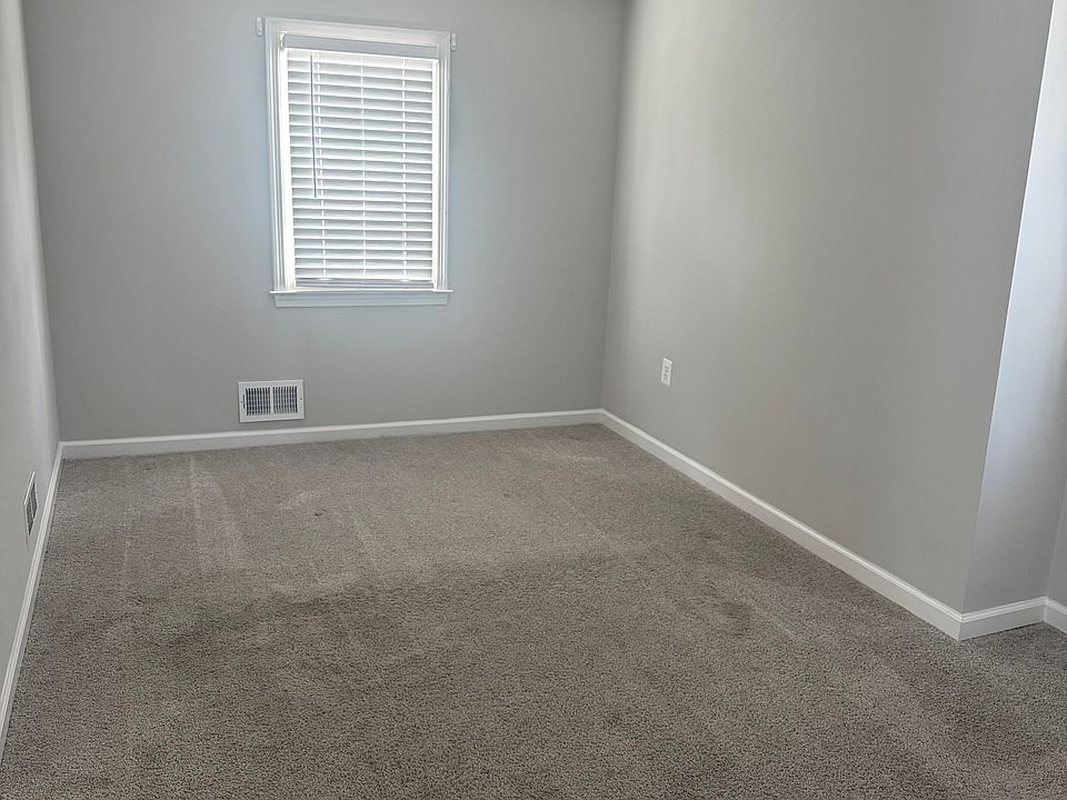 Master Bedroom facing backyard (yes, this fits a king bed w/ headboard against window) .