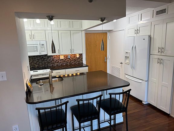 Large Quartz Counter with plenty of storage on both sides