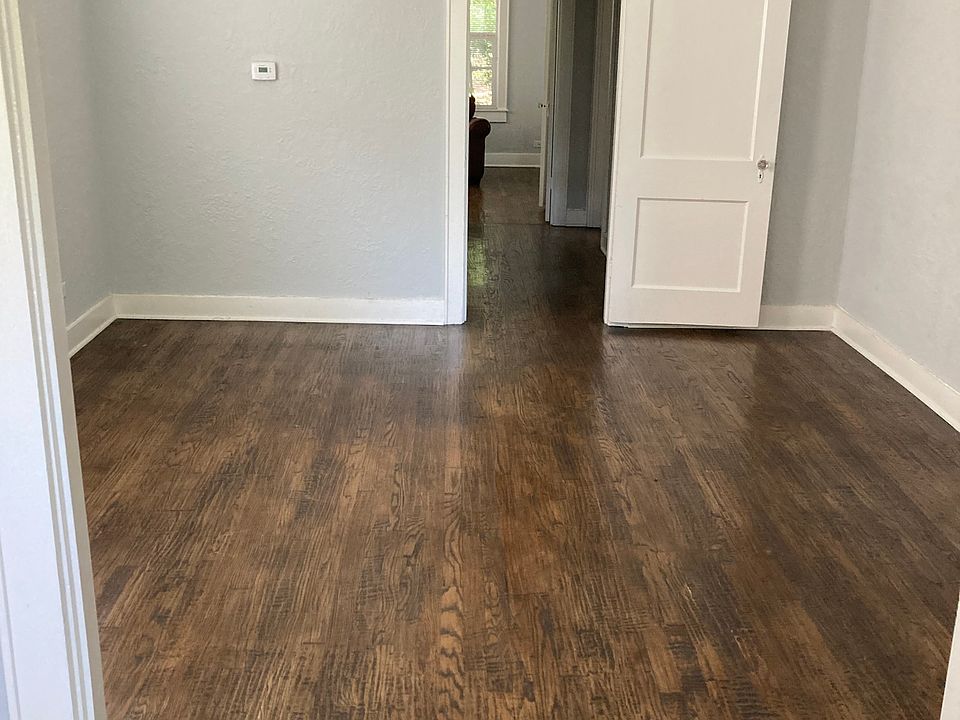 Dining Room to Hallway Leading to Bath and Bedrooms -- Kitchen is to the Right