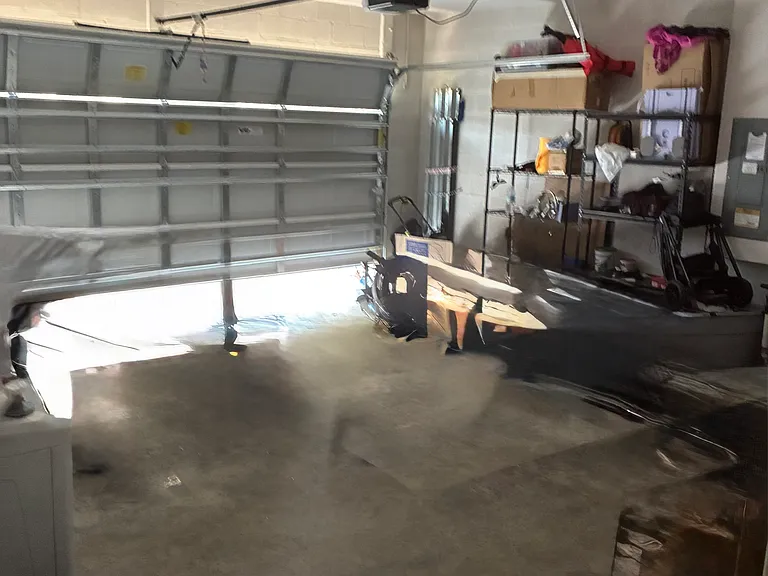 2 car garage and additional storage in attic.